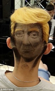 چهره ترامپ بر سر جوان تایوانی (+عکس) چهره ترامپ بر سر جوان تایوانی (+عکس)