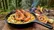 طرز تهیه پاستای میگوی خامه‌ای در دل جنگل؛ آشپزی روی سنگ داغ